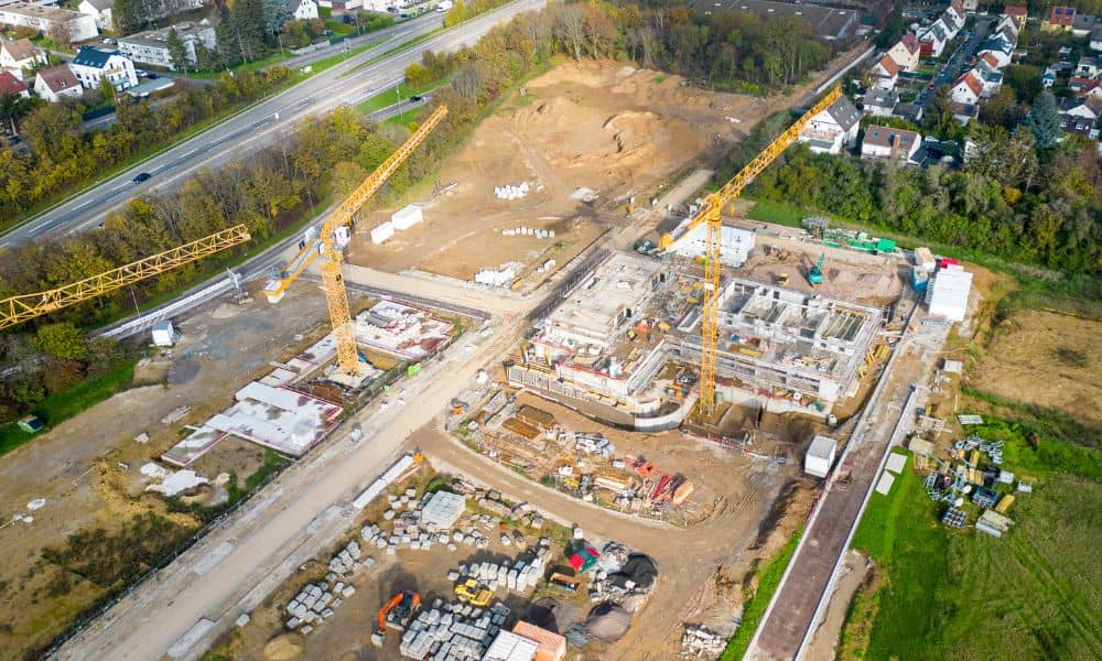 Alta survey large scale development site | ALTA Land Survey Aerial view of a large development site with construction areas, access roads, and surrounding land being considered in an ALTA survey